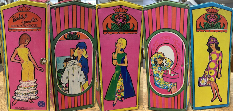 Five views of Barbie and Francie illustrations. On three sides a figure stands below a stained glass Tiffany-esque lamp, and on the remaining two sides are pink-and-orange striped siding, maybe, surrounding rounded windows in which the characters are seen posing with closing or seated at the vanity. One of these views shows Francie in a Bloom Bursts Color Magic ensemble, which didn't really fit her--but that's what the dressing room is for!